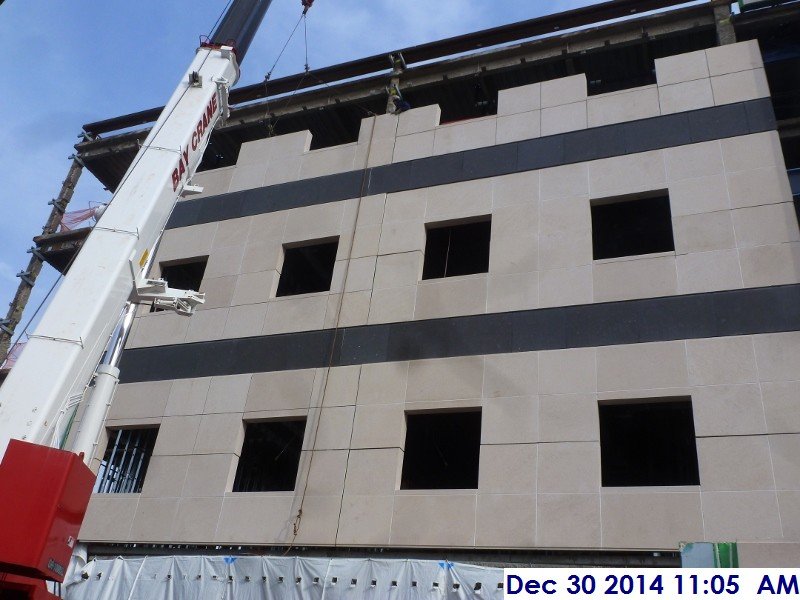 Erecting the stone panels at the West Elevation